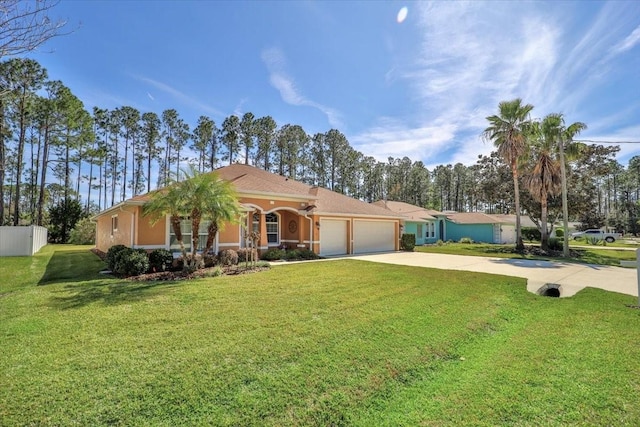 mediterranean / spanish home with driveway, a front lawn, an attached garage, and fence