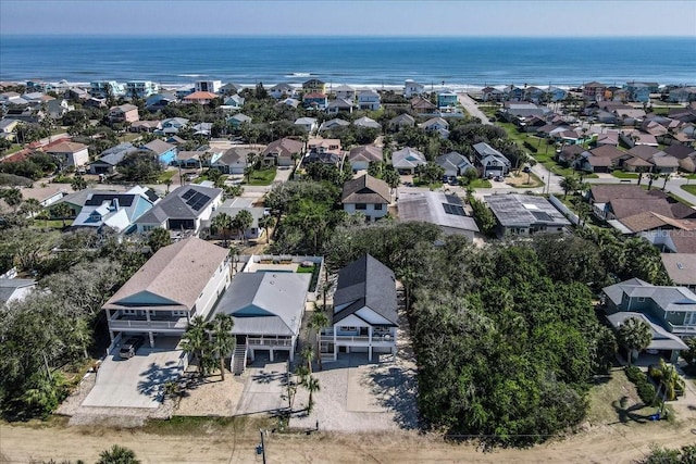 birds eye view of property featuring a water view and a residential view