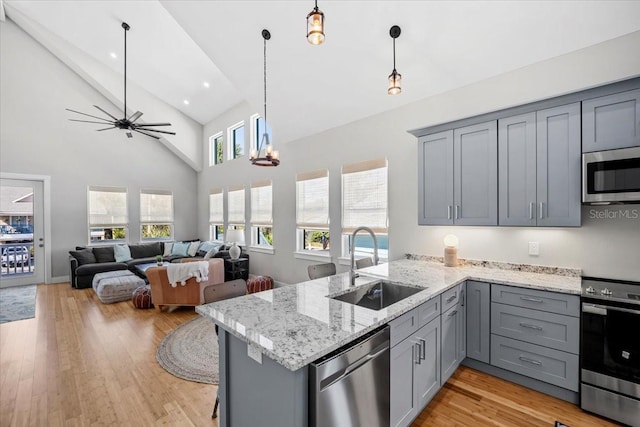 2737 John Bull, Flagler Beach, FL 32136 - kitchen featuring appliances with stainless steel finishes, a sink, and gray cabinetry