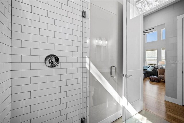 2737 John Bull, Flagler Beach, FL 32136 - bathroom with a stall shower and wood finished floors