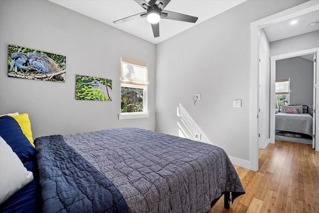 2737 John Bull, Flagler Beach, FL 32136 - bedroom with a ceiling fan, light wood-style flooring, and baseboards