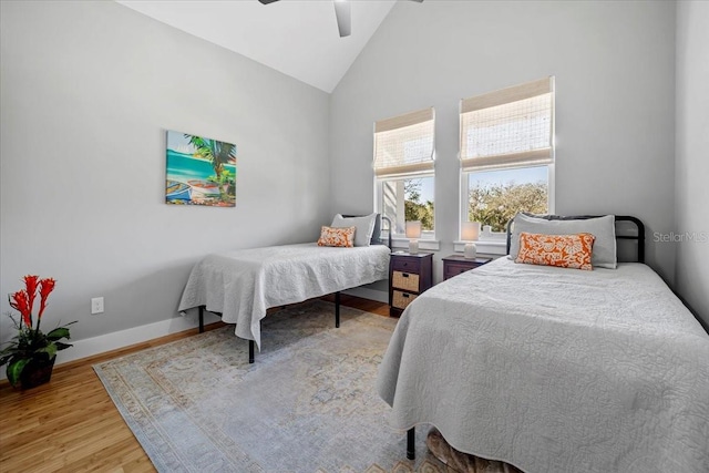 2737 John Bull, Flagler Beach, FL 32136 - bedroom featuring high vaulted ceiling, a ceiling fan, baseboards, and wood finished floors