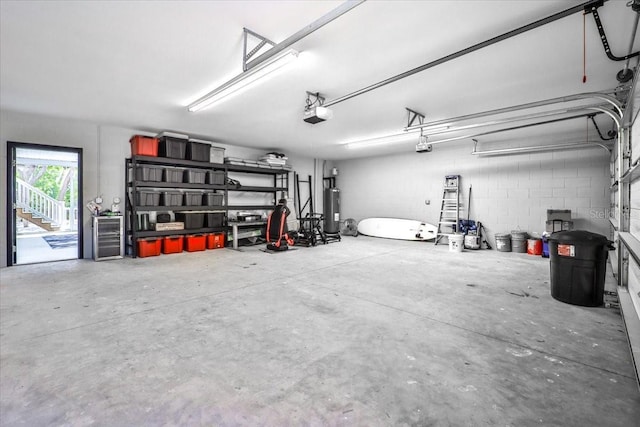 2737 John Bull, Flagler Beach, FL 32136 - garage with a garage door opener and electric water heater