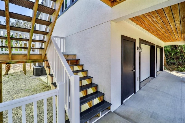 2737 John Bull, Flagler Beach, FL 32136 - property entrance featuring central air condition unit and stucco siding