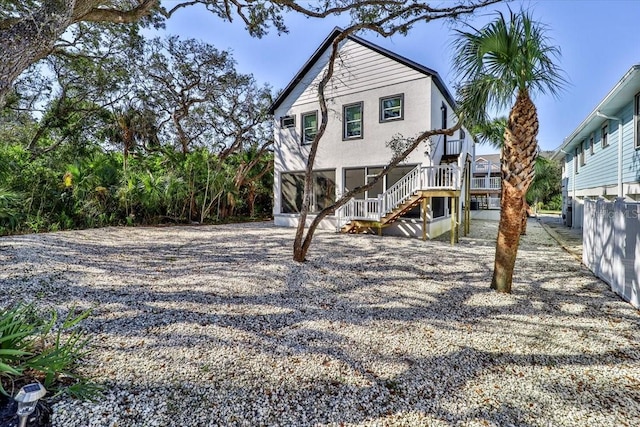 2737 John Bull, Flagler Beach, FL 32136 - rear view of property featuring stairway and stucco siding