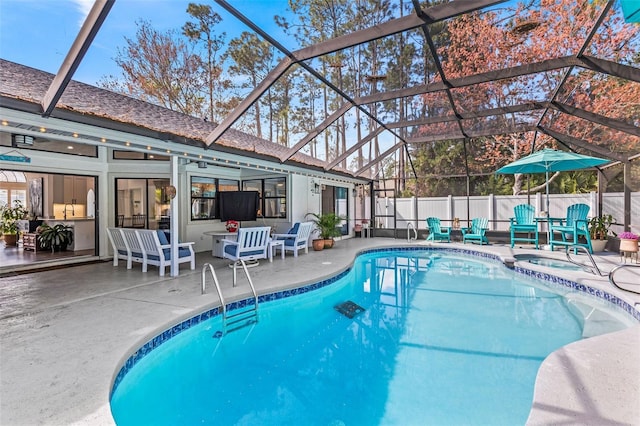 view of pool featuring a fenced in pool, a lanai, fence, and a patio