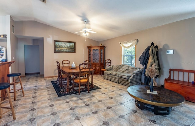 dining space featuring vaulted ceiling, visible vents, and a ceiling fan