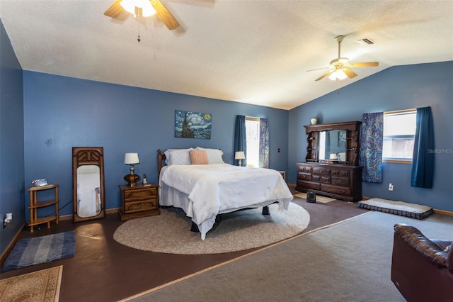 bedroom featuring lofted ceiling, ceiling fan, multiple windows, and visible vents