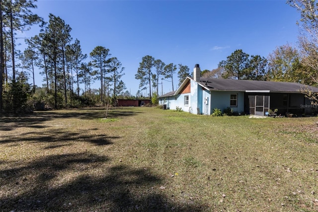 view of yard with a sunroom