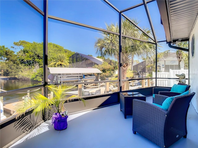 sunroom with a water view and a healthy amount of sunlight