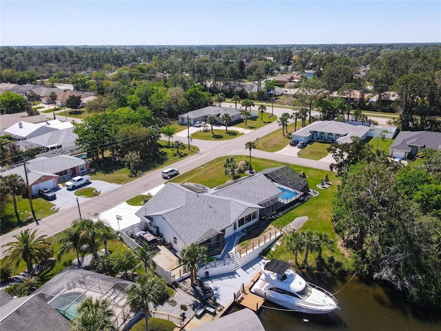 bird's eye view featuring a water view and a residential view