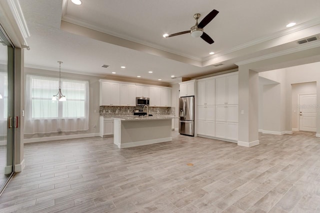1068 Sea Shell Ct, Daytona Beach, FL 32124 - kitchen featuring stainless steel appliances, a raised ceiling, visible vents, decorative backsplash, and open floor plan