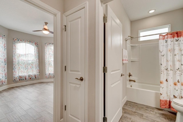 1068 Sea Shell Ct, Daytona Beach, FL 32124 - bathroom featuring baseboards, a ceiling fan, toilet, wood tiled floor, and shower / bathtub combination with curtain