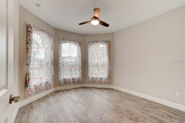 1068 Sea Shell Ct, Daytona Beach, FL 32124 - unfurnished room with light wood-type flooring, a ceiling fan, and baseboards