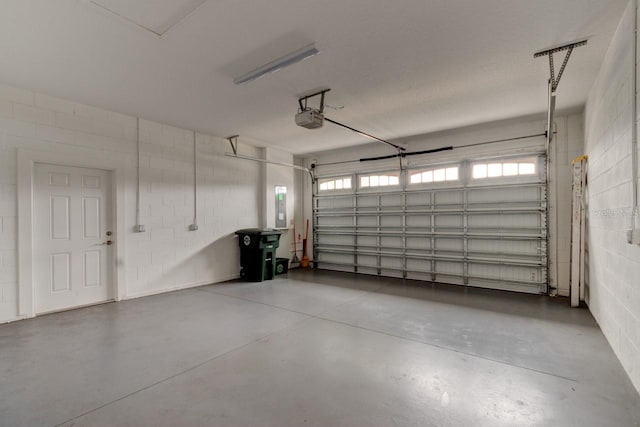 1068 Sea Shell Ct, Daytona Beach, FL 32124 - garage featuring concrete block wall, electric panel, and a garage door opener