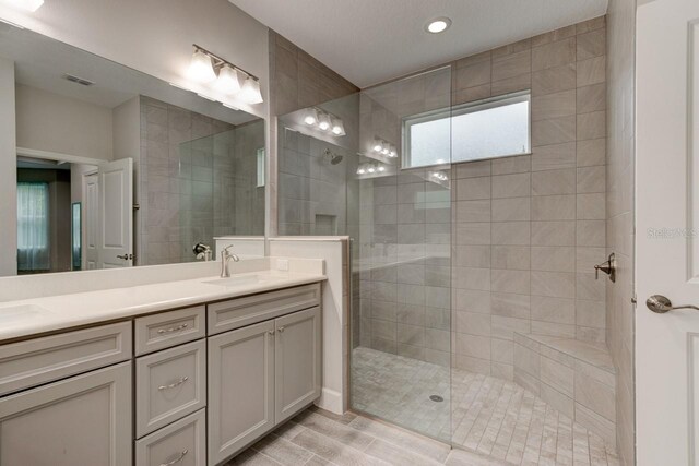 1068 Sea Shell Ct, Daytona Beach, FL 32124 - bathroom featuring double vanity, walk in shower, a sink, and visible vents