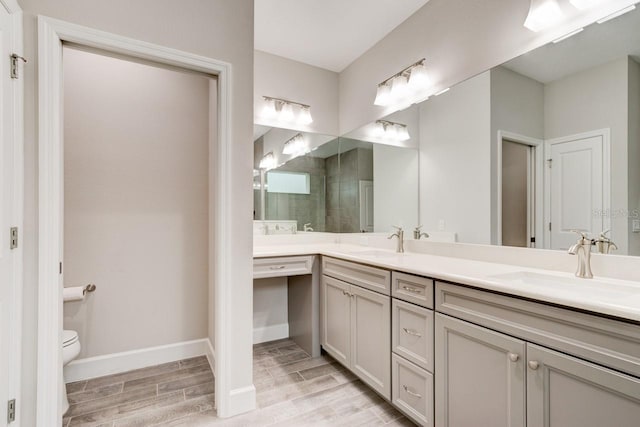 1068 Sea Shell Ct, Daytona Beach, FL 32124 - full bathroom with baseboards, double vanity, a sink, and wood tiled floor