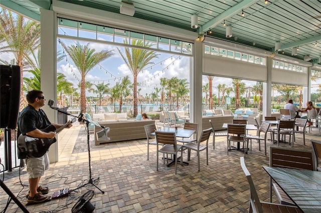 1068 Sea Shell Ct, Daytona Beach, FL 32124 - sunroom / solarium featuring track lighting