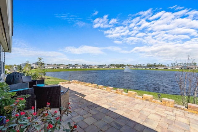 view of patio / terrace with a water view