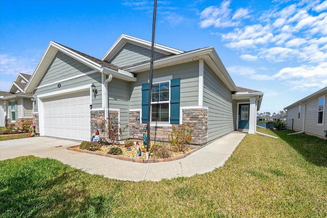 craftsman-style home with stone siding, an attached garage, driveway, and a front yard