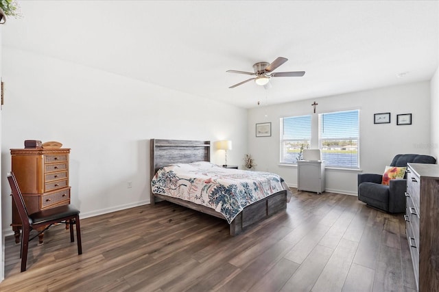 bedroom featuring dark wood-style flooring, ceiling fan, and baseboards