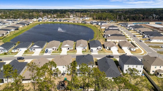 drone / aerial view with a residential view and a water view