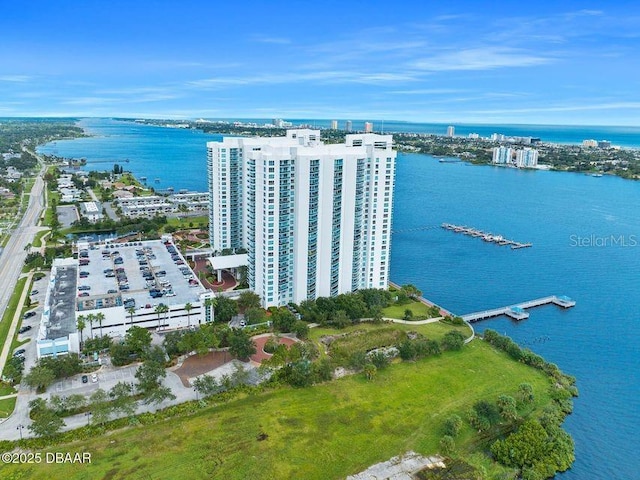 aerial view featuring a water view and a view of city