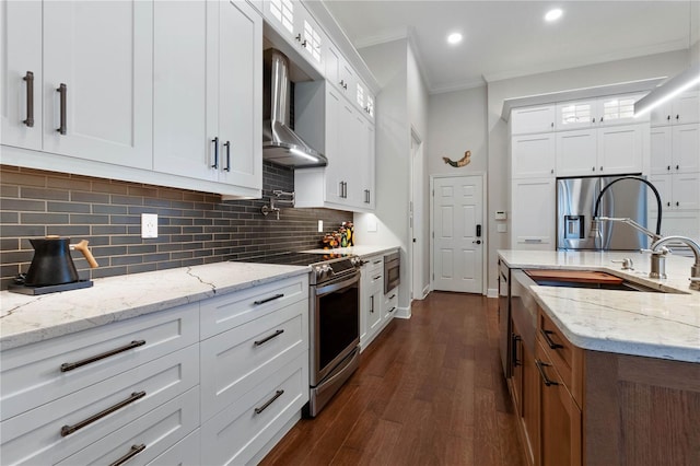 kitchen featuring light stone countertops, stainless steel appliances, glass insert cabinets, and white cabinets