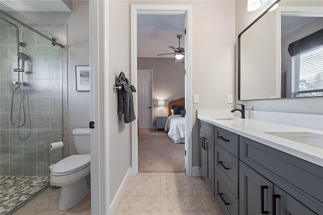 ensuite bathroom featuring double vanity, toilet, ensuite bath, tile patterned floors, and a sink