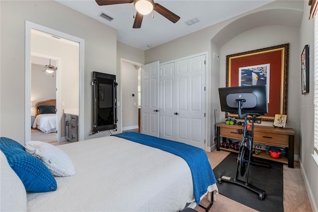 carpeted bedroom with ceiling fan, a closet, visible vents, and baseboards