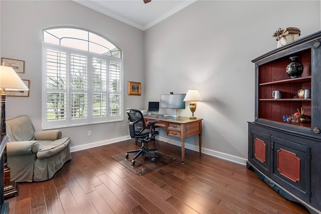 office area with dark wood-type flooring, a healthy amount of sunlight, ornamental molding, and baseboards