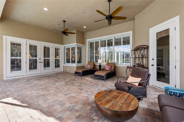 view of patio featuring a ceiling fan, french doors, and outdoor lounge area