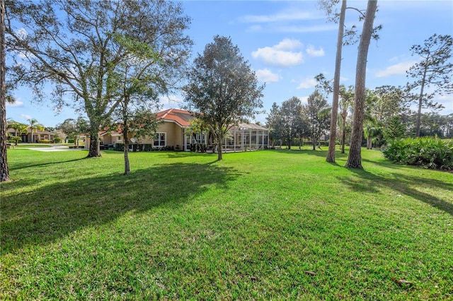 view of yard featuring a lanai