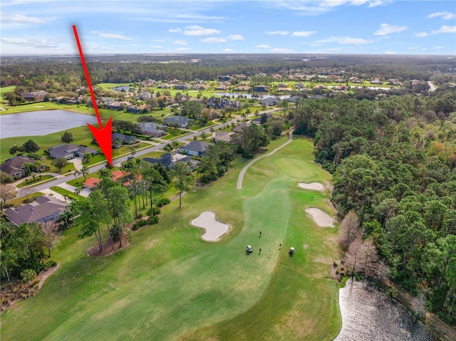 birds eye view of property featuring a water view and golf course view