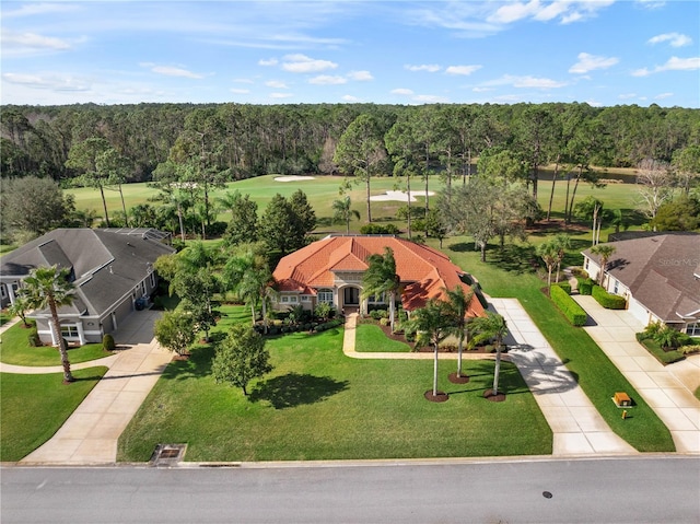 birds eye view of property featuring a forest view