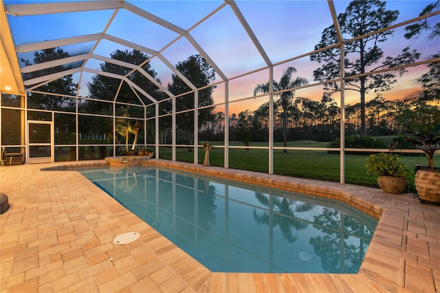 outdoor pool with a yard, a lanai, and a patio