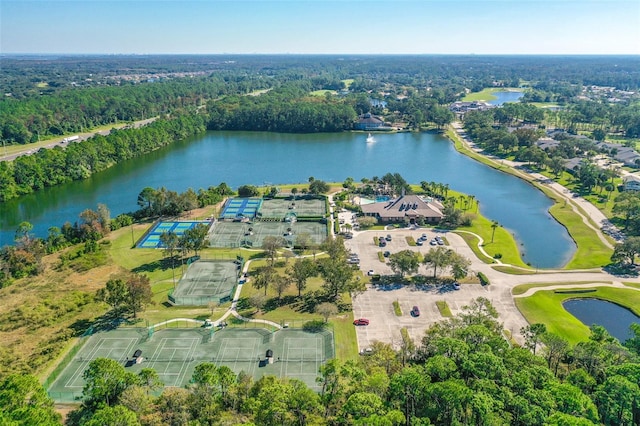 aerial view featuring a water view and a wooded view