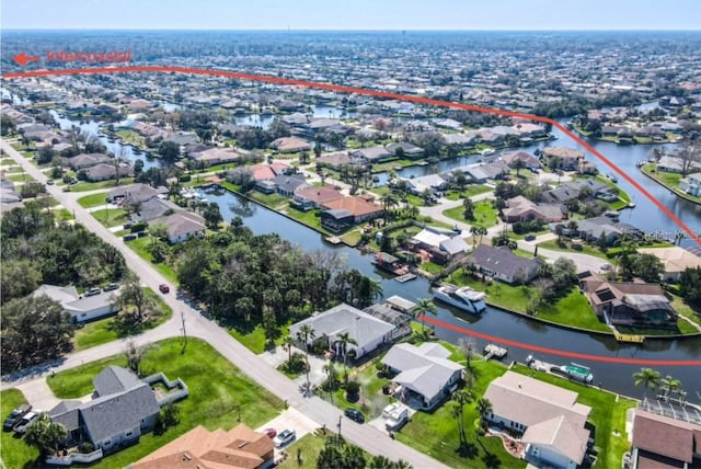 bird's eye view featuring a residential view and a water view