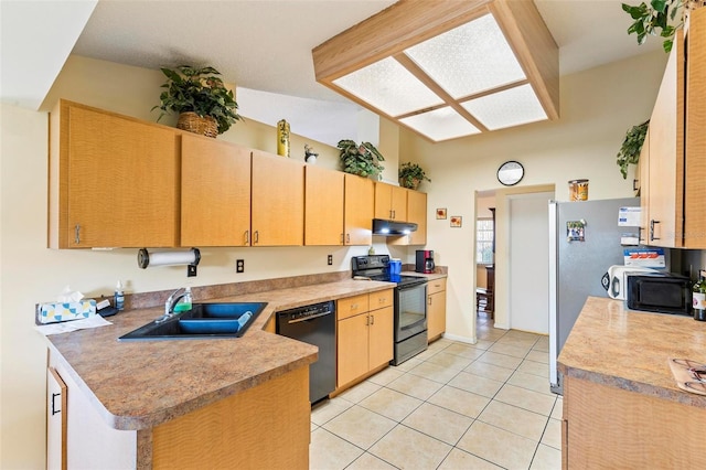 kitchen with light tile patterned floors, under cabinet range hood, light countertops, black appliances, and a sink