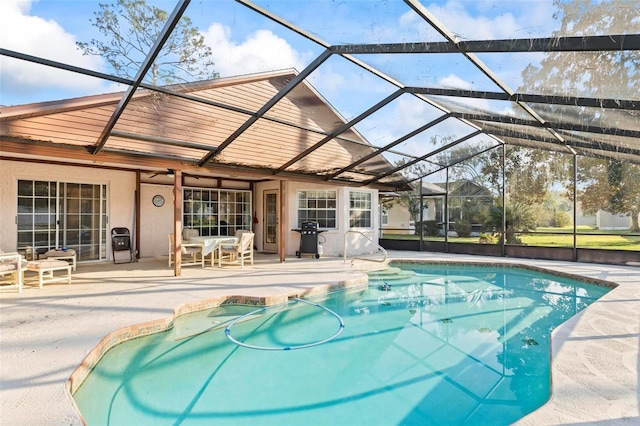 outdoor pool featuring a ceiling fan, a lanai, a patio, and grilling area