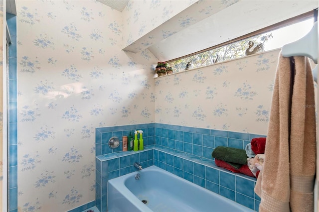 full bathroom with a bath and wallpapered walls