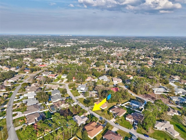 birds eye view of property with a residential view