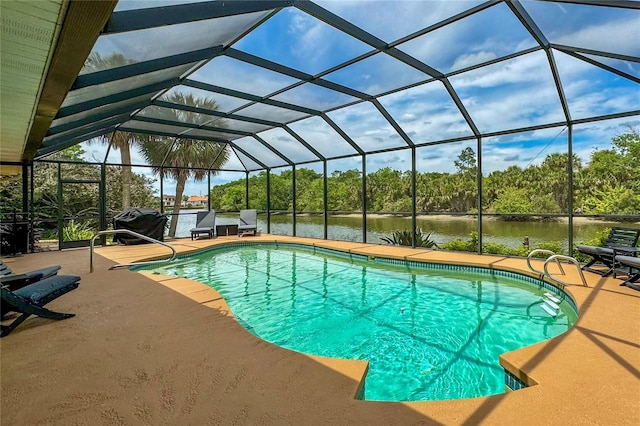 outdoor pool featuring a lanai, a water view, and a patio