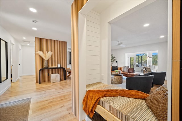 corridor featuring light wood-style floors and recessed lighting