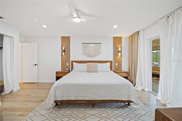 bedroom featuring a ceiling fan, recessed lighting, light wood-style flooring, and access to exterior