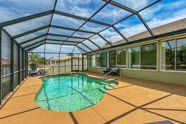 outdoor pool with a lanai, a patio, and fence