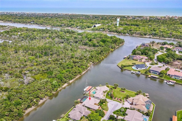 aerial view featuring a water view, a residential view, and a view of trees