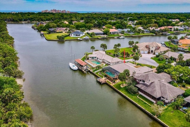 bird's eye view featuring a residential view and a water view