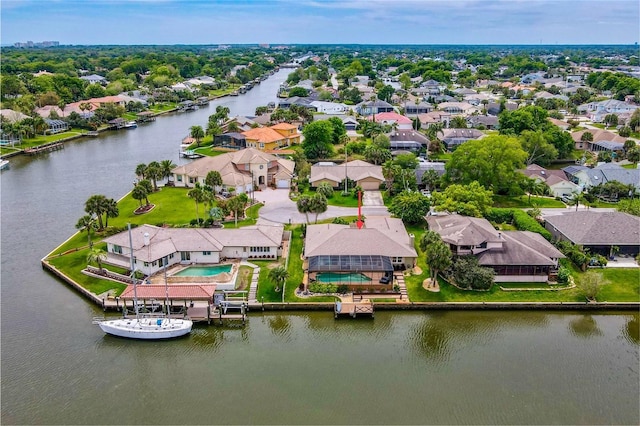 birds eye view of property featuring a residential view and a water view