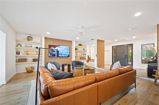 85 Comanche Ct, Palm Coast, FL 32137 - living room with light wood-style floors, built in shelves, recessed lighting, baseboards, and ceiling fan
